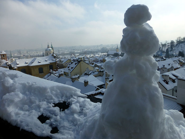 Snow man looking enjoying his view in Prague